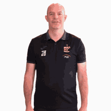 a man wearing a black shirt with a pge logo on the front