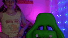 a woman in a yellow tank top that says minty lemon tasty juice