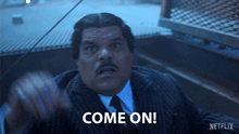 a man in a suit says come on in a netflix ad