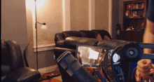 a person sitting in a chair with a steering wheel in front of them