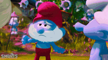 a smurf with a sad look on his face and the word smurfs on the bottom