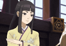 a cartoon girl with long black hair and a yellow kimono