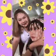 two girls with flowers painted on their faces pose for a picture
