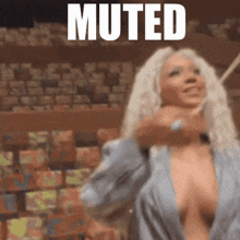 a woman with a plunging neckline is standing in front of a sign that reads muted
