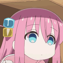 a girl with pink hair and blue eyes has a cube on her head with the letter u and v on it