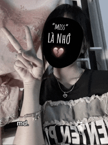 a girl wearing a mask that says miss la nho