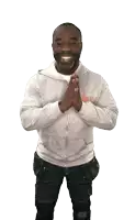 a man wearing a grey sweatshirt with a nike logo on it is praying