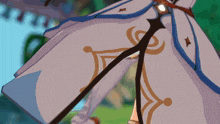 a close up of a person 's pants with a blue and gold design on them