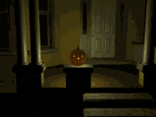 a pumpkin with a face carved into it is on display