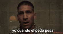 a man in a plaid shirt is crying with yo cuando el pedo pesa written below him