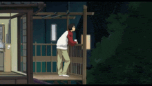 a man standing on a balcony looking out into the night