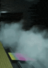 a laptop with a lot of smoke coming out of it