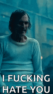 a man in a white sweater says i fucking hate you .