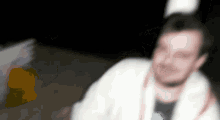 a blurry picture of a man in a robe