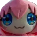 a close up of a pink stuffed animal with blue eyes .