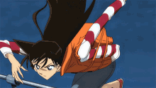 a man in a life jacket watches a girl in an orange life vest jump into the air