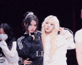a group of girls posing for a photo with the letters ld on the bottom right