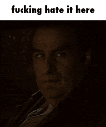 a picture of a man with the words fucking hate it here
