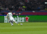a soccer player wearing number 30 kicking a ball