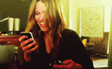 Sophia Bush Getting A Text GIF - Sophia Bush Getting A Text Happy GIFs
