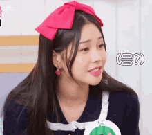 a woman wearing a red bow on her head has a question mark above her