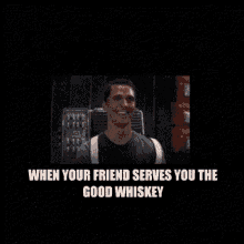 a man is sitting in front of a microphone and says when your friend serves you the good whiskey .
