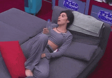 a woman laying on a bed with a sign that says price shock