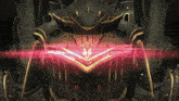 a close up of a robot with a red light coming out of its eyes