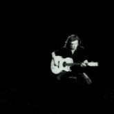 a black and white photo of a man and a woman with the word veed on the bottom