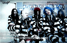 a group of people in striped outfits are sitting in front of a sign that says ' the incubus circus ' on it