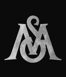 a gold letter w on a black background with a swirl