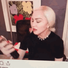 Madonna Perfume GIF - Madonna Perfume Spray GIFs