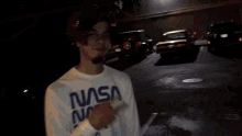 a man wearing a red hat and a white shirt that says dickies