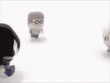 a group of cartoon characters are walking on a white surface .