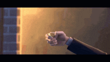 a close up of a man 's hand holding something