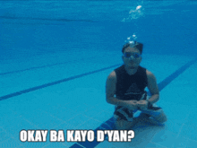 a man giving a thumbs up in a swimming pool with okay ba kayo dyan written below him