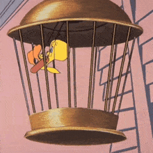a cartoon bird is flying in a cage with a fan