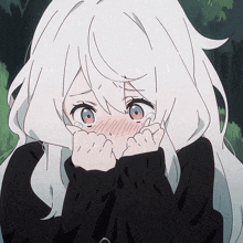 a girl with white hair and red eyes is covering her mouth with her hands