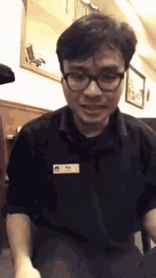 a man wearing glasses and a name tag that says ruby on it