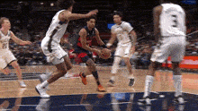 a basketball player wearing a number 3 jersey dribbles the ball