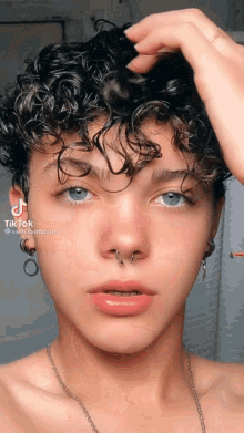 a close up of a person 's face with the hashtag tik tok