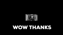 a black and white photo of a man sitting in front of a computer and the words wow thanks .