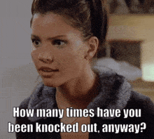 a woman in a fur coat is asking how many times have you been knocked out anyway ?
