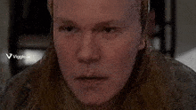 a close up of a man 's face with the words viggle.ai on the bottom