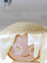 a close up of a cookie with a smiley face on it