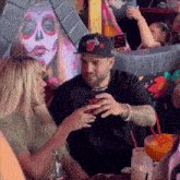 a man wearing a hat with a miami heat logo on it
