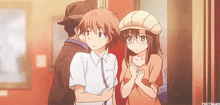 a man and a girl are standing next to each other in a room .