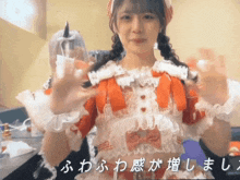 a woman in a red and white dress with chinese writing on the bottom