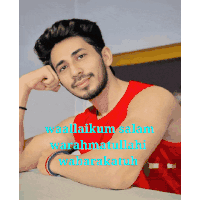 a man in a red tank top with the words waallahum salam warahmatullahi wabarakatuh