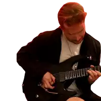 a man in a black jacket is playing an electric guitar with the letter e on the neck